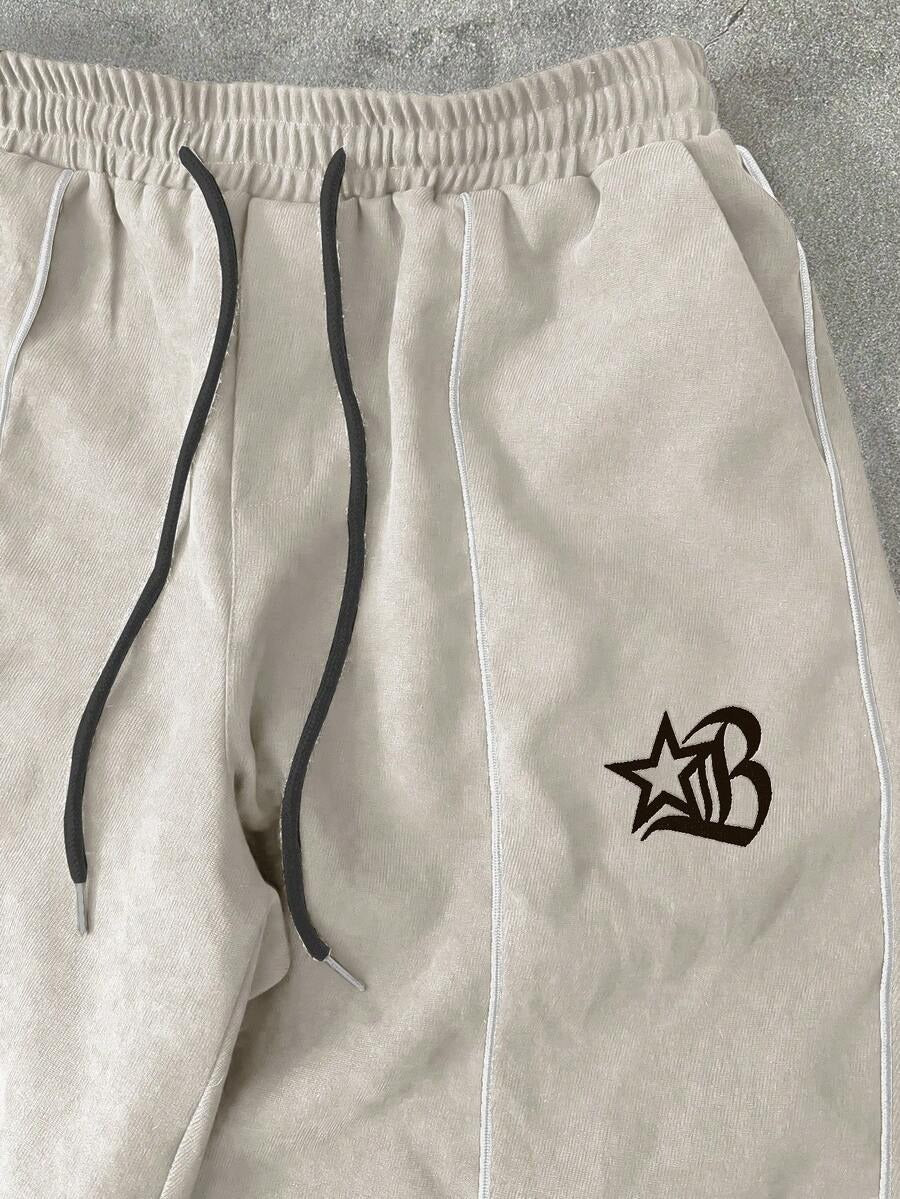Manfinity EMRG Tuta da uomo composta da giacca con cerniera e ricamo a lettere, pantaloni lunghi con coulisse in vita