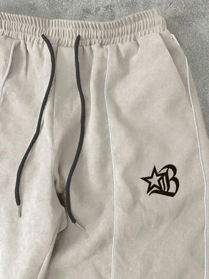 Manfinity EMRG Tuta da uomo composta da giacca con cerniera e ricamo a lettere, pantaloni lunghi con coulisse in vita