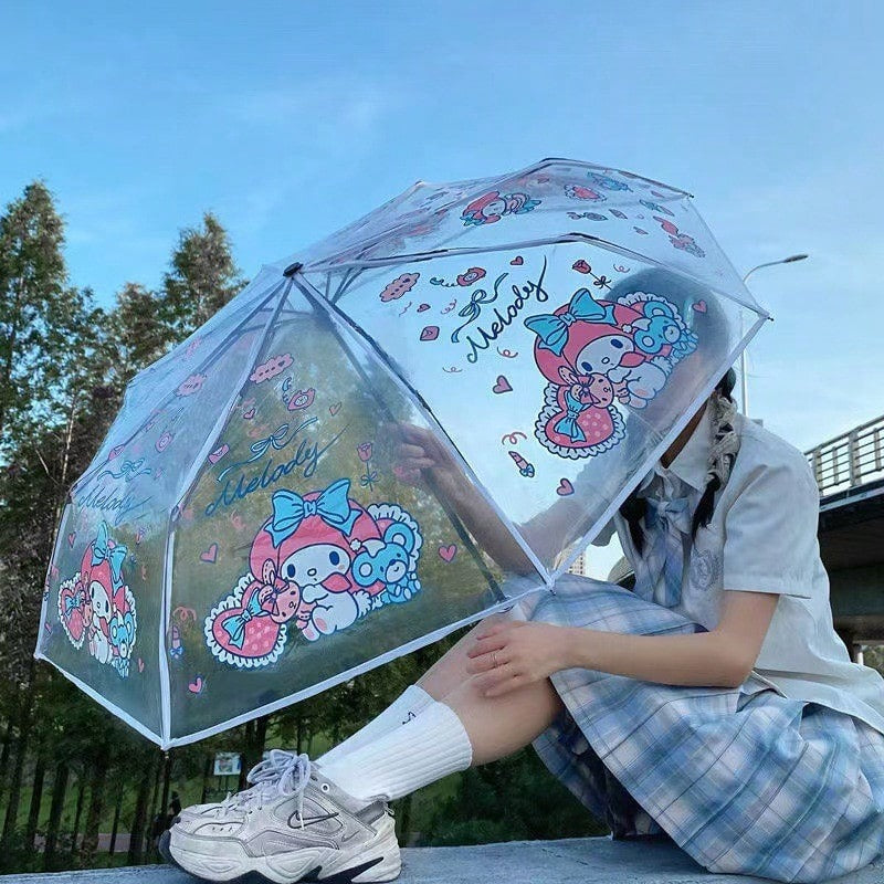 Ombrello pieghevole trasparente portatile carino con personaggi dei cartoni animati Sanrio Hello Kitty e Kuromi, ombrello manuale pieghevole Jade Guigou Melody Sanrio adatto per sole, pioggia, come regalo, accessorio da esterno